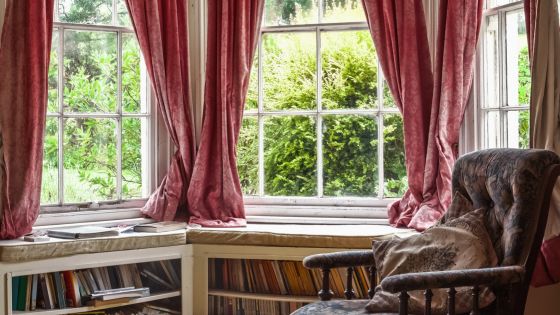  A beautifully designed bay window with natural light streaming through, creating a warm and inviting atmosphere in the room.